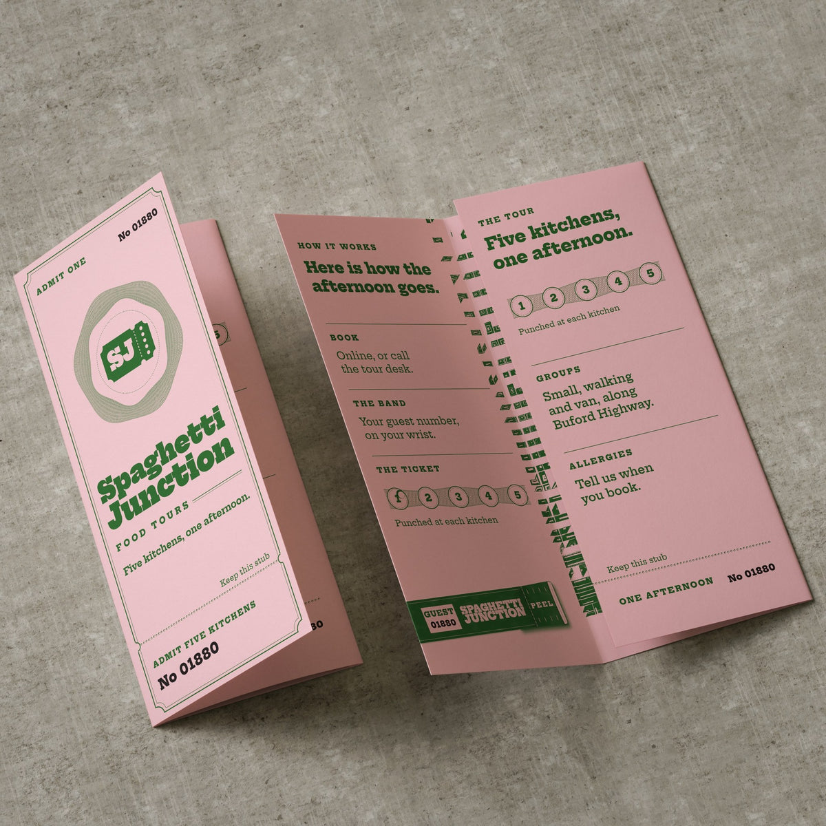 Sample design: Spaghetti Junction Food Tours tri-fold brochures, one standing folded and one open