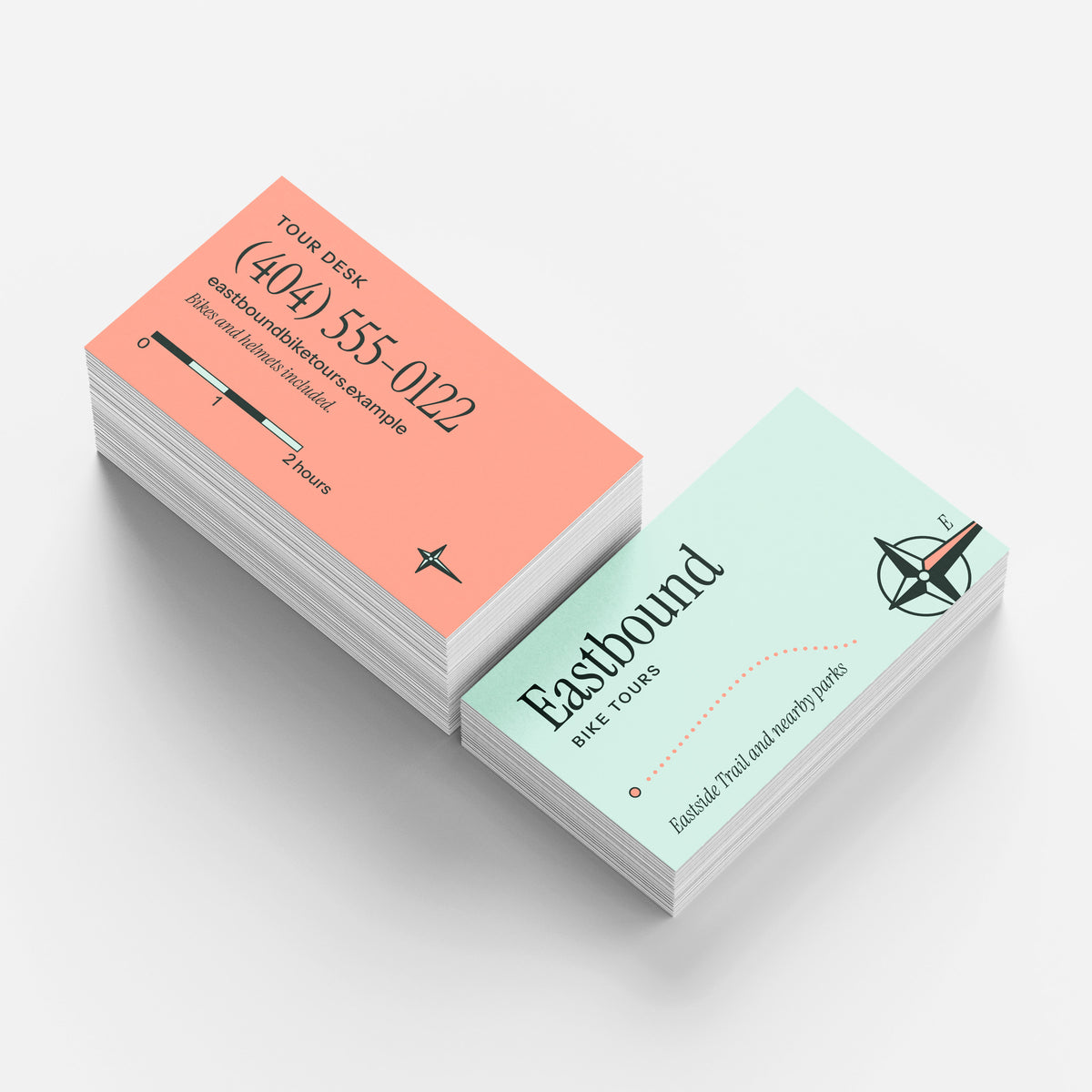Sample design: Eastbound Bike Tours business cards, two stacks with the edges visible